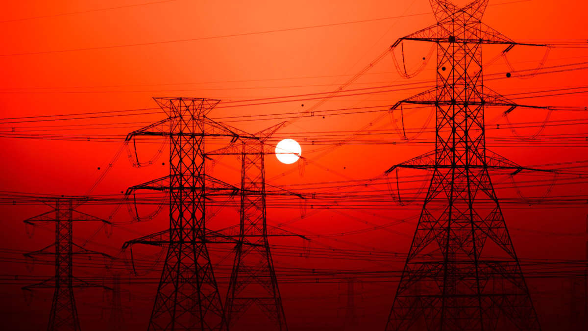 Electric power line grids over red sky