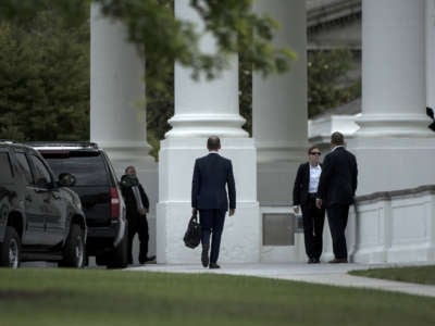 Trump adviser Stephen Miller walks to a motorcade from the White House, June 21, 2017, in Washington, D.C.