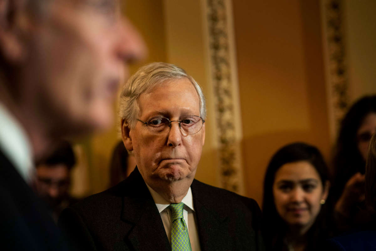 Senate Majority Leader Mitch McConnell, surrounded by his leadership, answers questions from journalists concerning the approaching Senate impeachment trail on Capitol Hill in Washington, D.C., December 17, 2019.