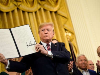 Donald Trump holds an executive order