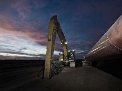 Construction equipment works on an oil painting