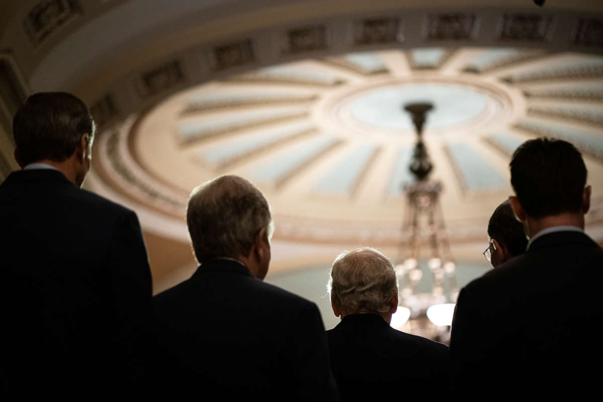 A view of the back of several republican's heads