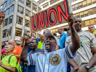 Union workers rally outside the NFL Headquarters in Manhattan, August 22, 2018.