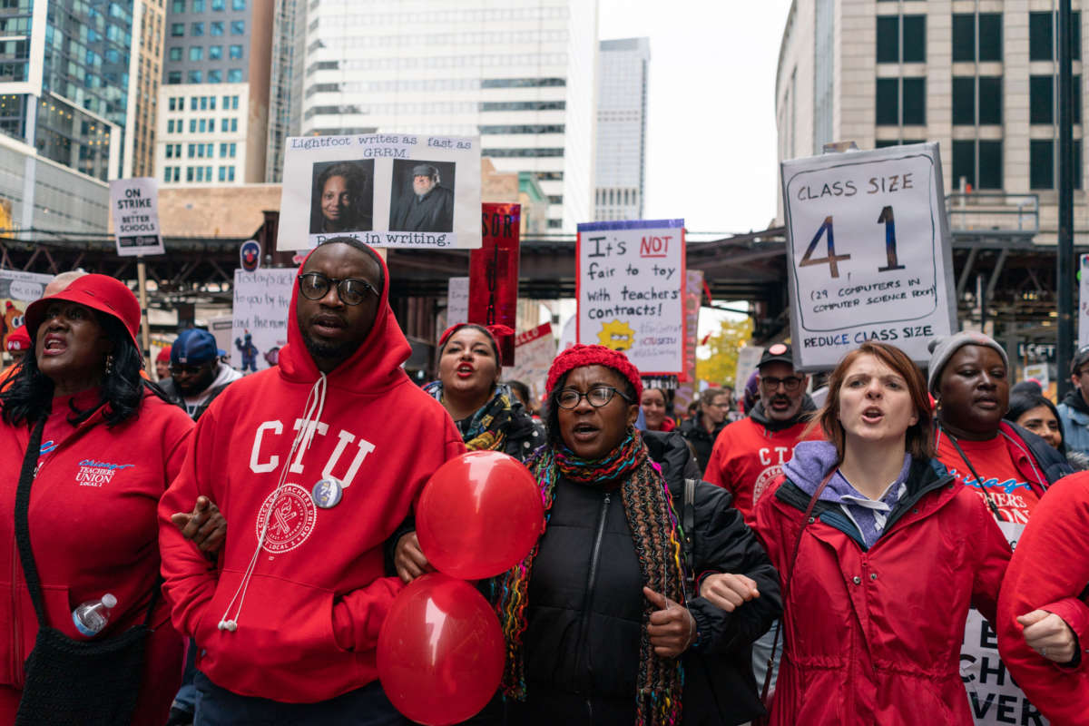 Striking teachers, school staff and supporters march through downtown Chicago on the ninth day of the Chicago Teachers Union strike on October 25, 2019.