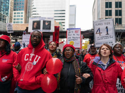 Striking teachers, school staff and supporters march through downtown Chicago on the ninth day of the Chicago Teachers Union strike on October 25, 2019.