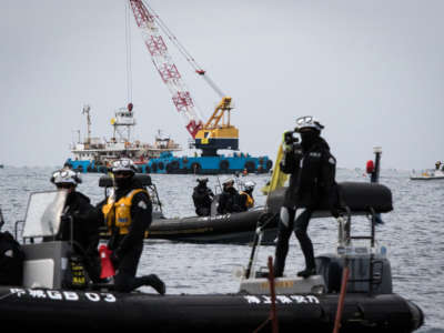 Japan Coast Guard is seen during a rally against the U.S. airbase construction in Oura Bay, Okinawa, Japan, on February 7, 2017.