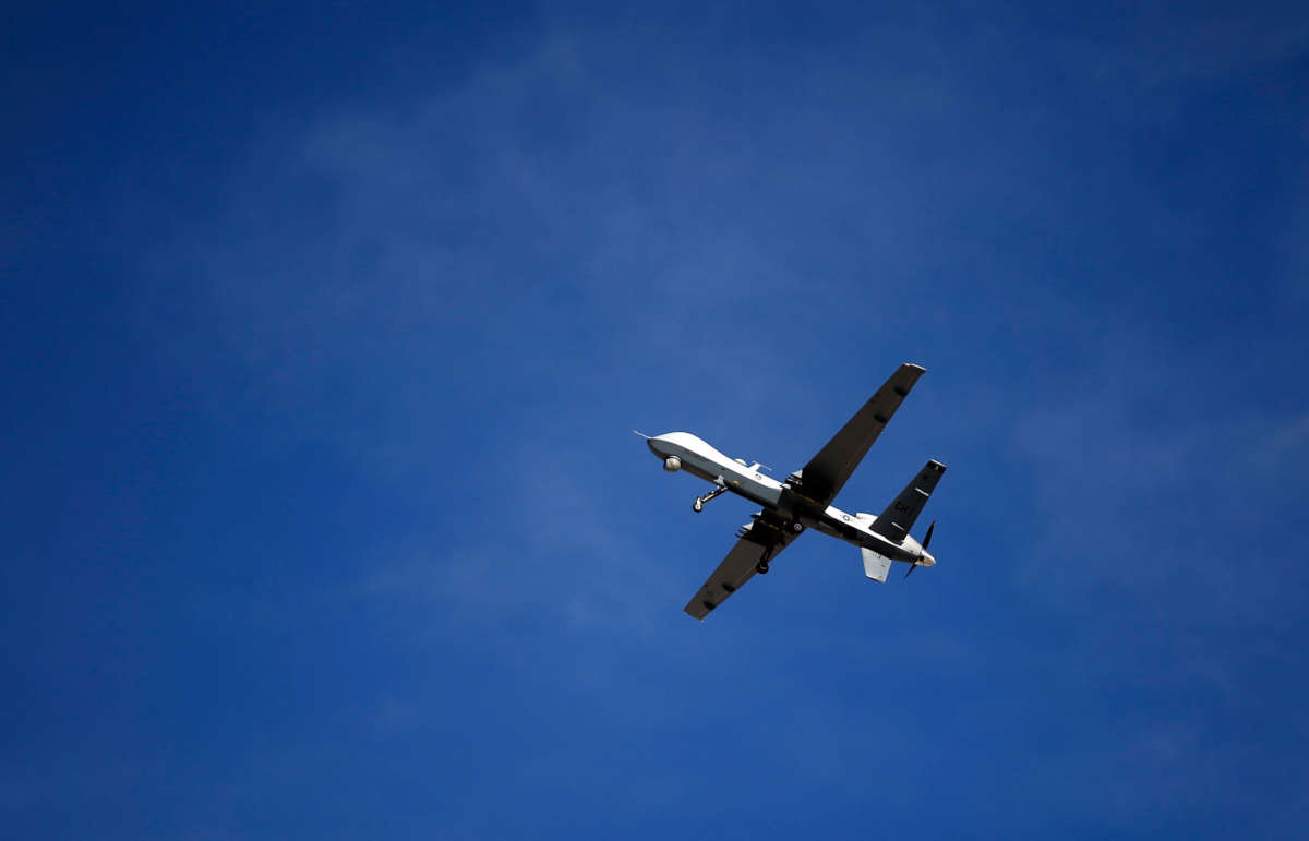 An MQ-9 Reaper remotely piloted aircraft flies by during a training mission at Creech Air Force Base on November 17, 2015, in Indian Springs, Nevada.