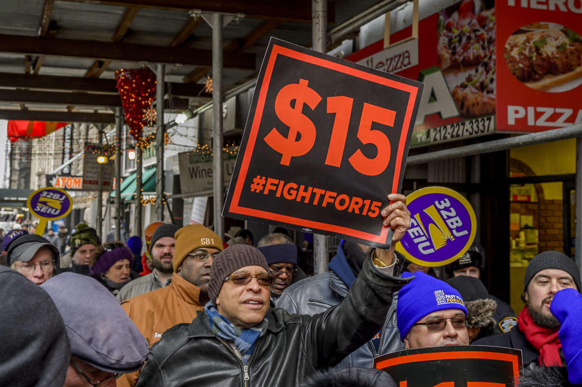 Workers in the "Fight for $15" demonstrate during the lunchtime rush to demand the rejection of fast-food mogul, Andy Puzder, as labor secretary in New York City on February 13, 2017.