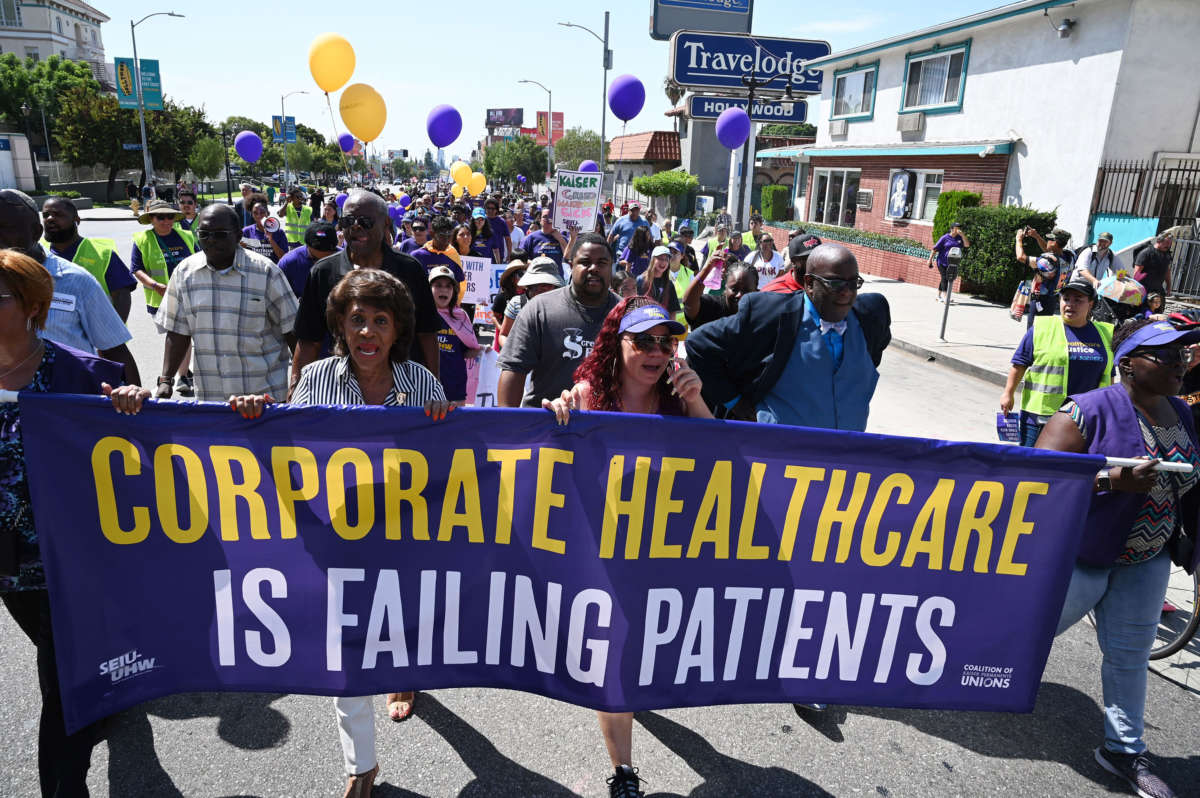 Congresswoman Maxine Waters, second from left, joins Kaiser Permanente healthcare workers, patients and their supporters in a Labor Day protest march, September 2, 2019, in Los Angeles, California.