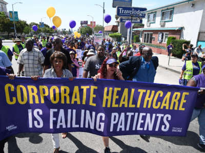 Congresswoman Maxine Waters, second from left, joins Kaiser Permanente healthcare workers, patients and their supporters in a Labor Day protest march, September 2, 2019, in Los Angeles, California.