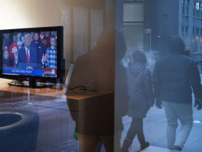 A television displays President Trump, the morning after he was impeached by the House of Representatives on December 19, 2019, in New York City.