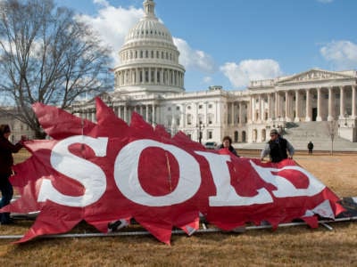 Demonstrators protest the Supreme Court's Citizens United decision outside the Capitol in Washington, D.C., on January 21, 2011.