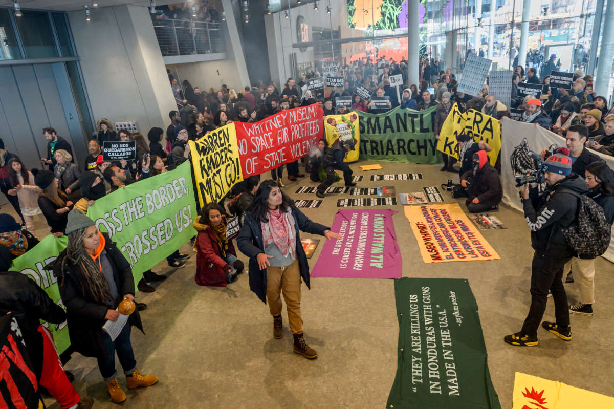 Activists took over the lobby at the Whitney Museum of American Art to protest and demand the removal of the museums board of directors Vice Chairman Warren B. Kanders.