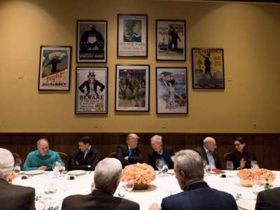 President Trump listens to Senate Majority Leader Mitch McConnell during a dinner with legislative leadership at Camp David, on January 5, 2018.