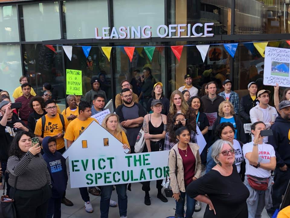 Area residents marched to a vacant luxury building in Oakland, California, on November 23, 2019, to denounce developers' overproduction of such units instead of building affordable housing for working families.