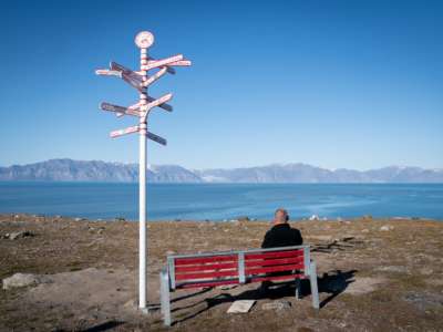 Signs show the distances to various cities in the town of Pond Inlet, in the Canadian Arctic, where a small Inuit settlement with only 1,300 inhabitants will deal with the consequences of climate change. Global warming here is two to three times stronger than in other regions of the world.