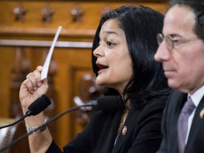 Rep. Pramila Jayapal holds up a pocket Constitution as she votes yes in the House Judiciary Committee markup of the articles of impeachment against President Donald Trump on Friday, December 13, 2019.