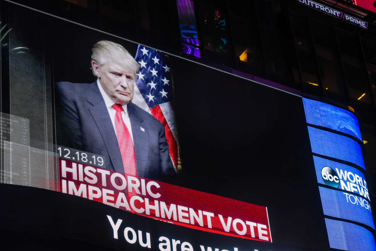 U.S. President Donald Trump is pictured on a screen in Times Square on December 18, 2019, in New York City.