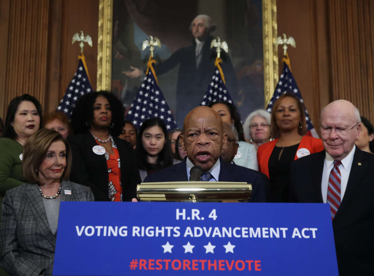 Rep. John Lewis speaks to the media ahead of the House vote on H.R. 4, The Voting Rights Advancement Act, on December 6, 2019, in Washington, D.C.
