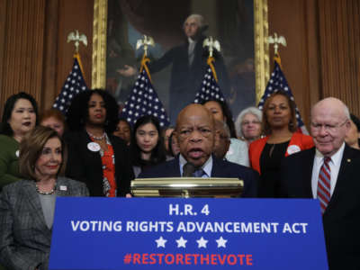 Rep. John Lewis speaks to the media ahead of the House vote on H.R. 4, The Voting Rights Advancement Act, on December 6, 2019, in Washington, D.C.