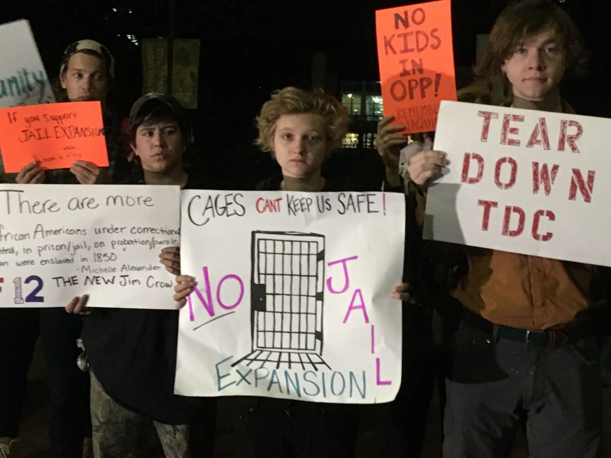 Activists hold signs at a press conference and protest against plans to expand the city jail in New Orleans on December 4. A grassroots coalition against expansion is driven by people of color and LGTBQ youth -- communities that are disproportionately criminalized on the streets of New Orleans. 