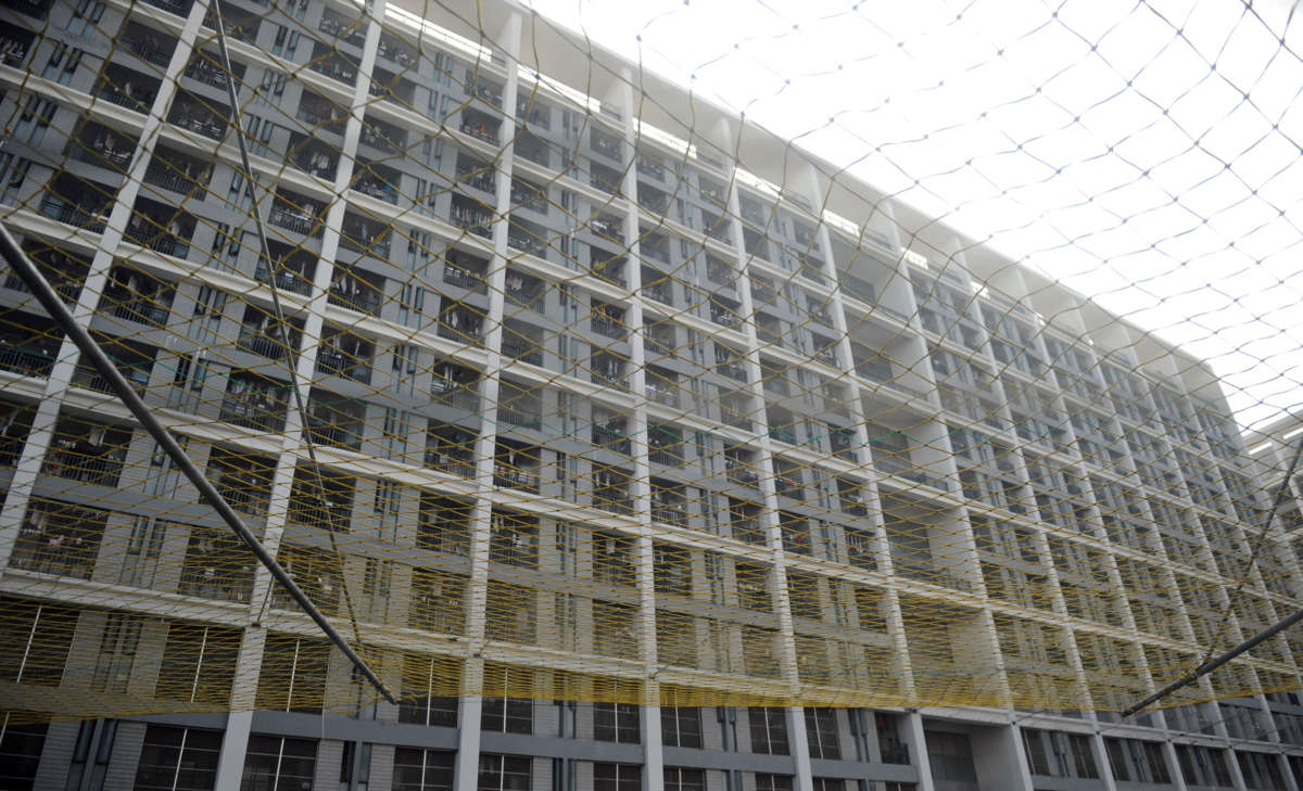 A view of an employee dormitory equipped with a suicide-prevention net is seen in Foxconn Technology Group's industrial complex on October 16, 2010, in Shenzhen of Guangdong Province, China.