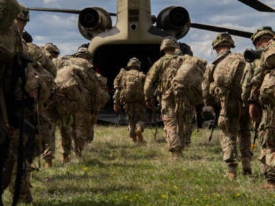 U.S. soldiers mount a CH-47 Chinook helicopter during an exercise at Udbina Airbase, Croatia, May 17, 2019.