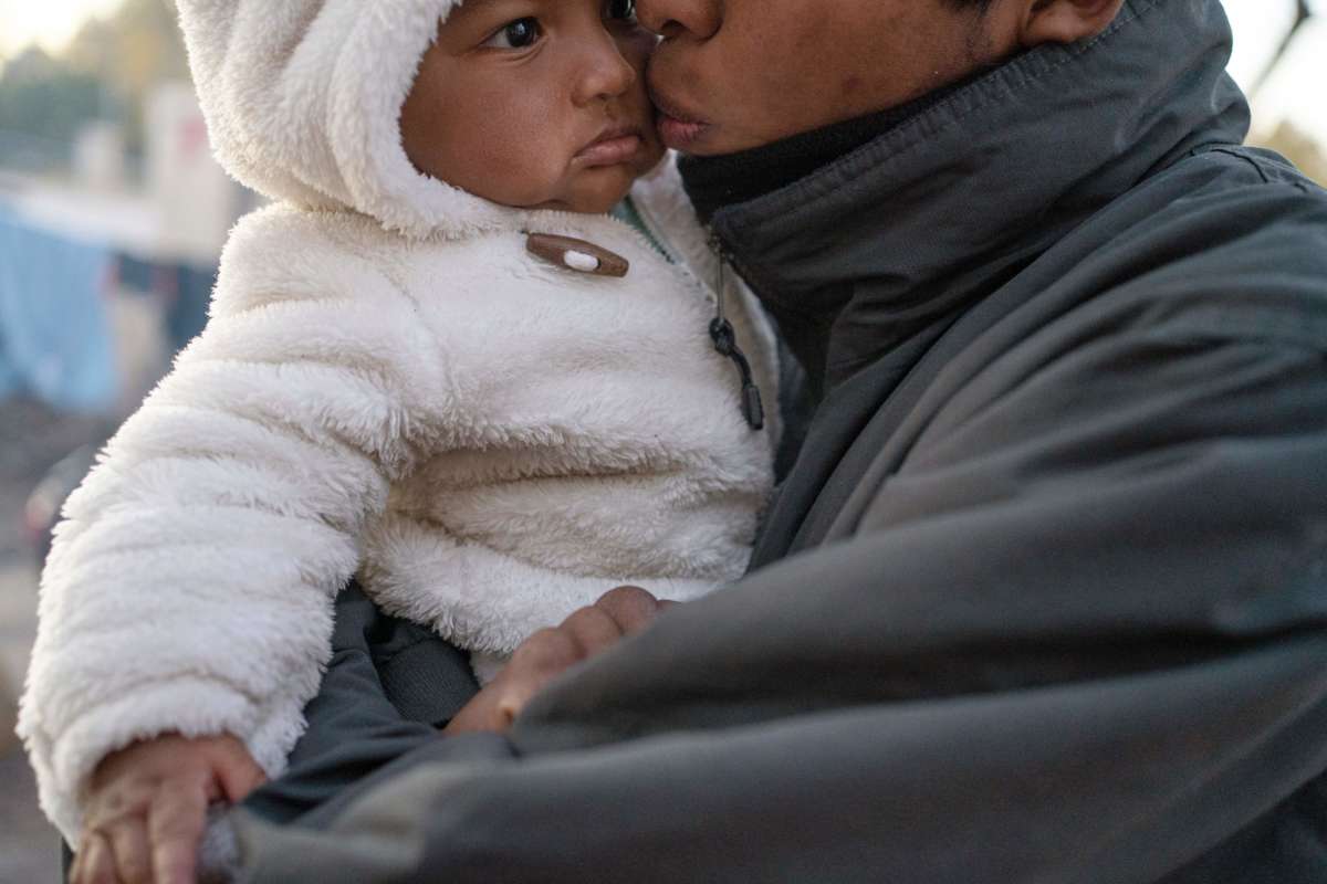 A father kisses his baby