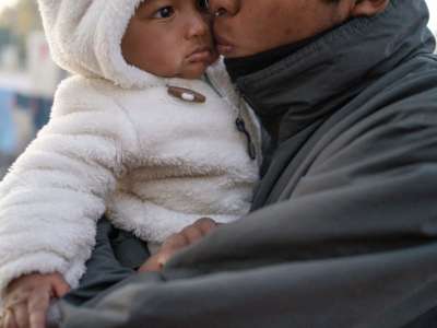 A father kisses his baby