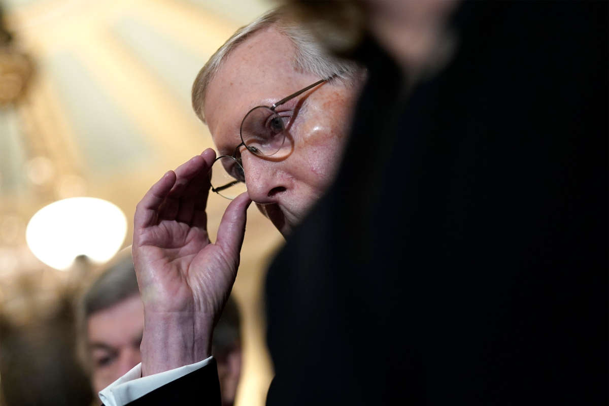 Senate Majority Leader Mitch McConnell waits to answer questions during a press conference at the U.S. Capitol