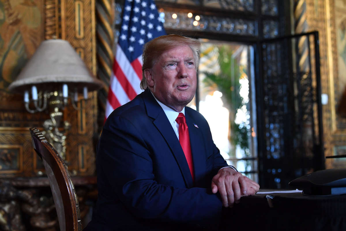 President Trump answers questions from reporters at the Mar-a-Lago estate in Palm Beach, Florida, on December 24, 2019.