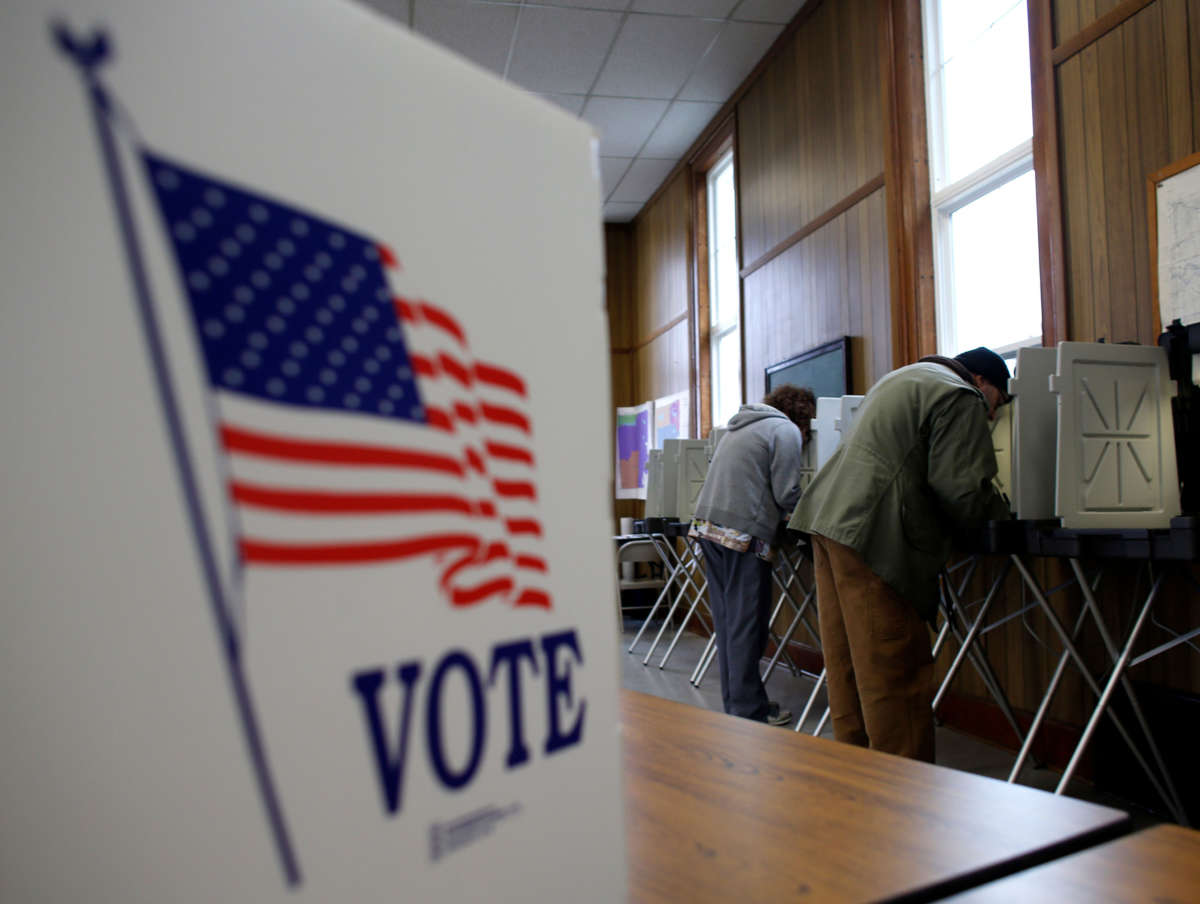 People cast their votes at a polling station on November 6, 2012, in Sugar Creek, Wisconsin.