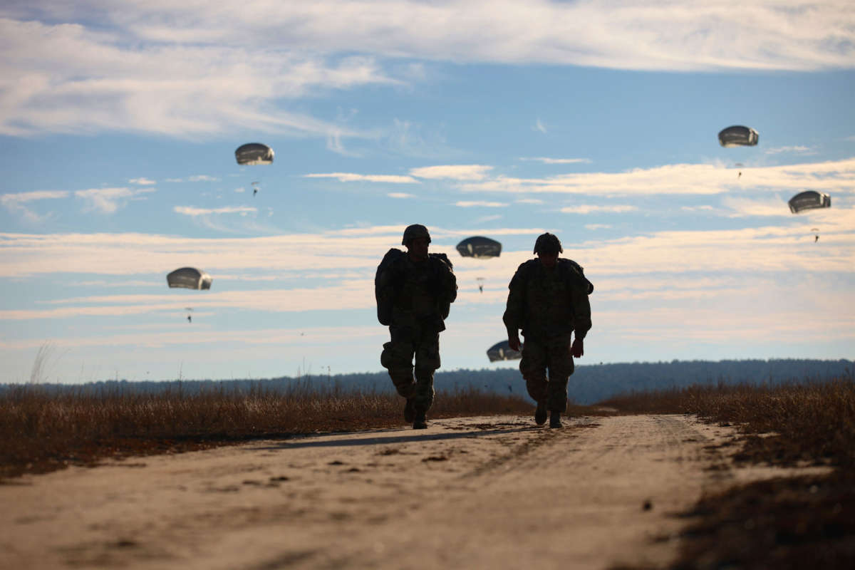 U.S. paratroopers return after completing their jumps at Fort Bragg, North Carolina, December 4, 2015.