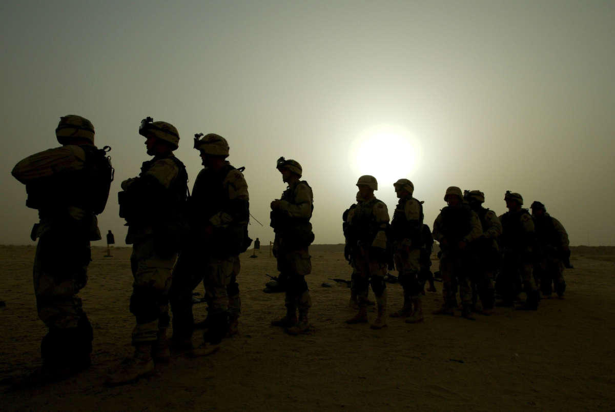U.S. troops train some 25 miles from the Iraqi border, near Camp New York, on January 21, 2003, in Kuwait, Iraq.