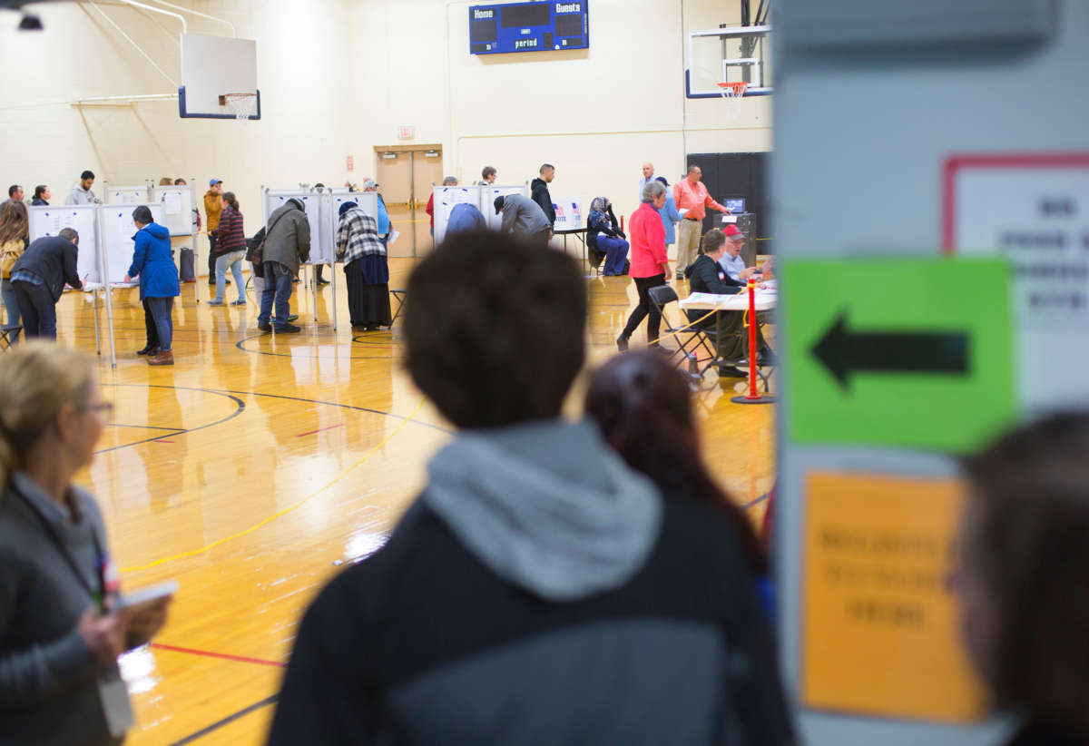 People vote at Howard C. Reiche Community School on November 6, 2018, in Portland, Maine.