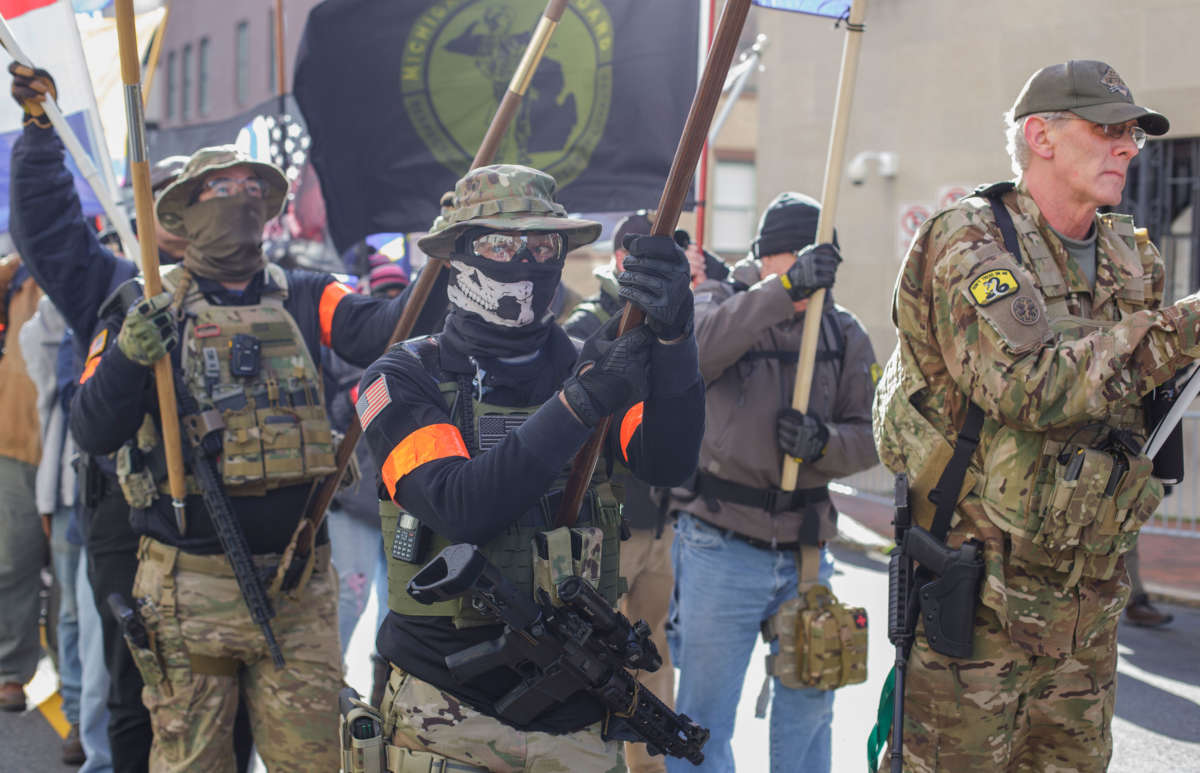 A roving phalanx of militia men, organized by the Light Foot Militia from Pennsylvania, march during a rally organized by The Virginia Citizens Defense League on Capitol Square near the state capitol building on January 20, 2020, in Richmond, Virginia.