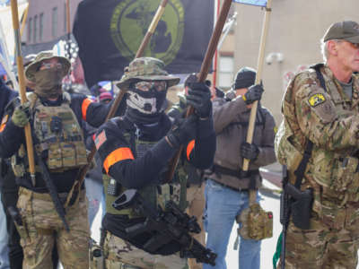 A roving phalanx of militia men, organized by the Light Foot Militia from Pennsylvania, march during a rally organized by The Virginia Citizens Defense League on Capitol Square near the state capitol building on January 20, 2020, in Richmond, Virginia.