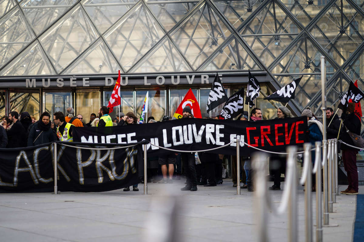 Strikers block the Louvre Museum entrance as a strike over planned pension reform continues in Paris, France, January 17, 2020.