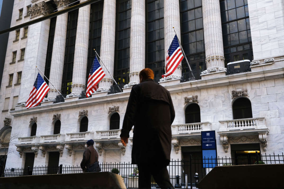 People walk by the New York Stock Exchange on January 21, 2020, in New York City.