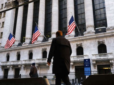 People walk by the New York Stock Exchange on January 21, 2020, in New York City.