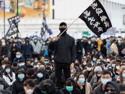 A protester holds a Free Hong Kong flag during an assembly to promote a march later that week, January 12, 2020, in Hong Kong, China.