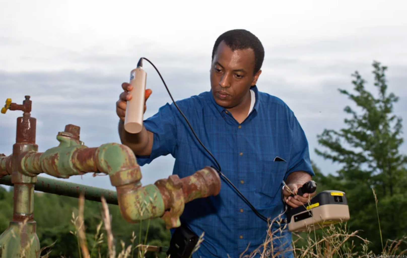 Natural Resources Defense Council (NRDC) scientist Bemnet Alemayehu checking a gas well for radiation in Indiana County, Pennsylvania.
