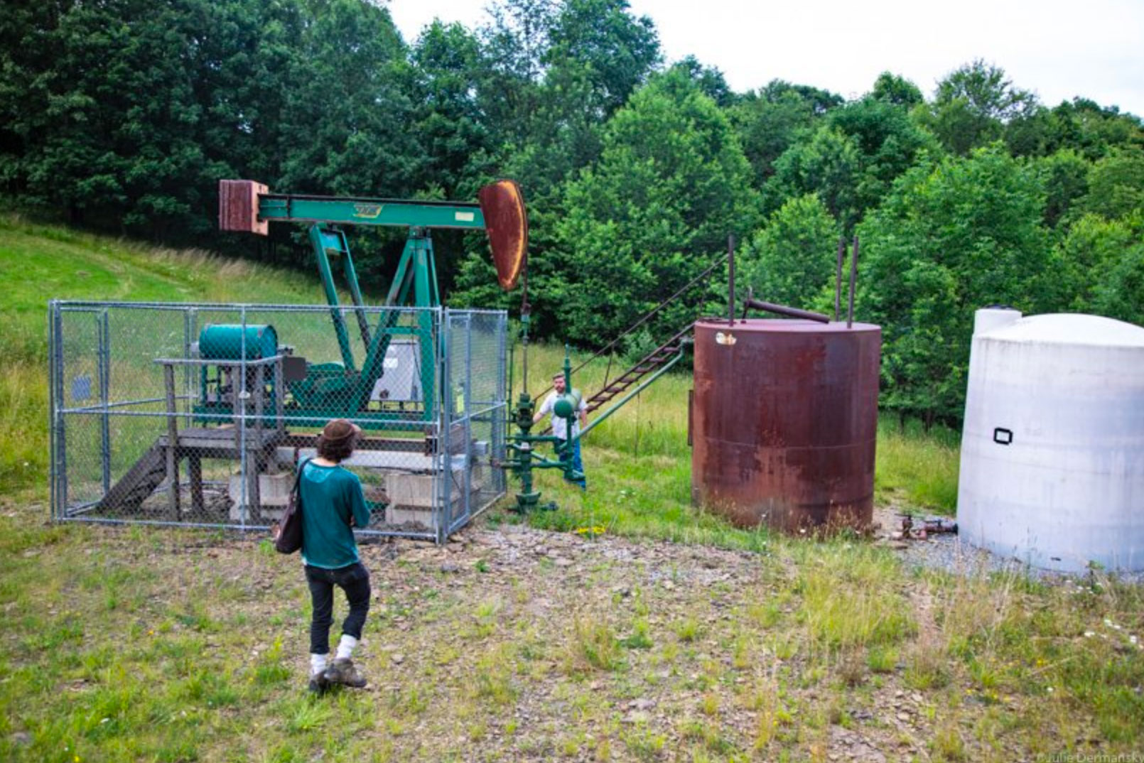 Reporter Justin Nobel with Mark Long, resident of Grant Township, Indiana County, Pennsylvania, checking a well on his property.