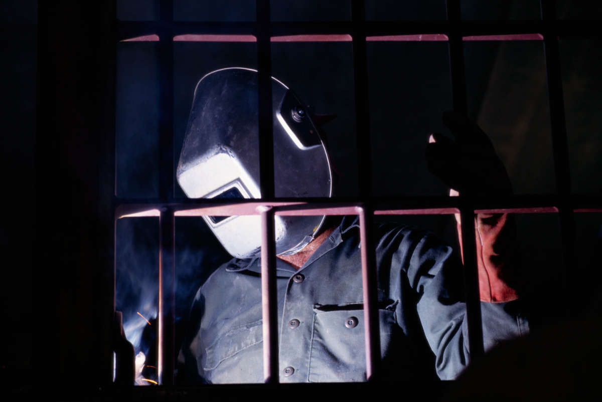 A welder works on the construction of a state prison in Kenedy, Texas.