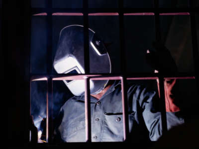 A welder works on the construction of a state prison in Kenedy, Texas.