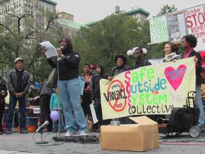 Demonstrators from the Audre Lorde Project's "Safe Outside the System Collective" participate in a march against police brutality in October 2006.