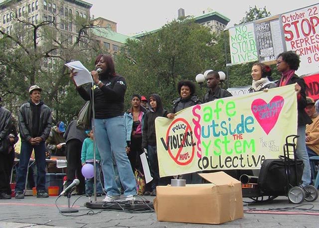 Demonstrators from the Audre Lorde Project's "Safe Outside the System Collective" participate in a march against police brutality in October 2006.