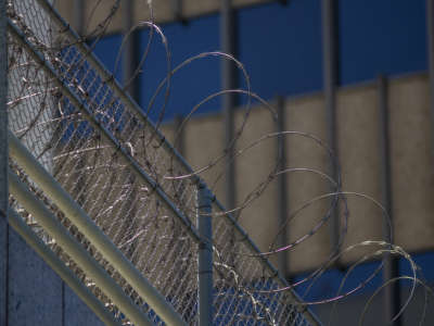 Razor wire is seen on the Metropolitan Detention Center prison on July 14, 2019, in Los Angeles, California.