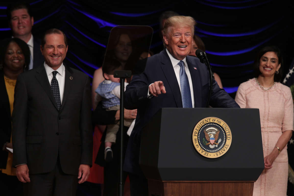 U.S. President Donald Trump speaks as Secretary of Health and Human Services Alex Azar and Administrator of Centers for Medicare and Medicaid Services Seema Verma listen during an event on kidney health at the Ronald Reagan Building and International Trade Center on July 10, 2019, in Washington, D.C.