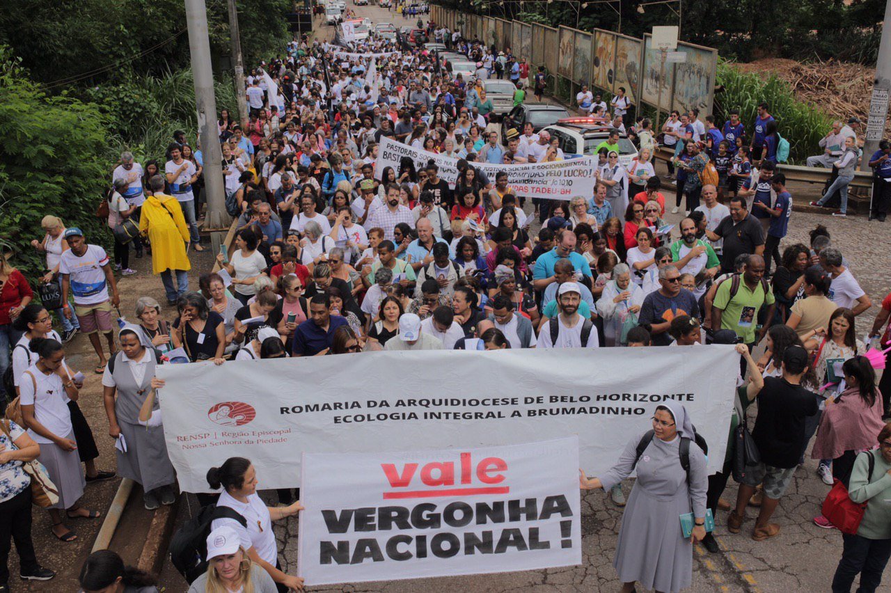 Movement of People Affected by Dams (MAB) and allies March through Brumadinho, Minas Gerais, Brazil, holding sign that says “Vale National Embarrassment” on January 25, 2020.
